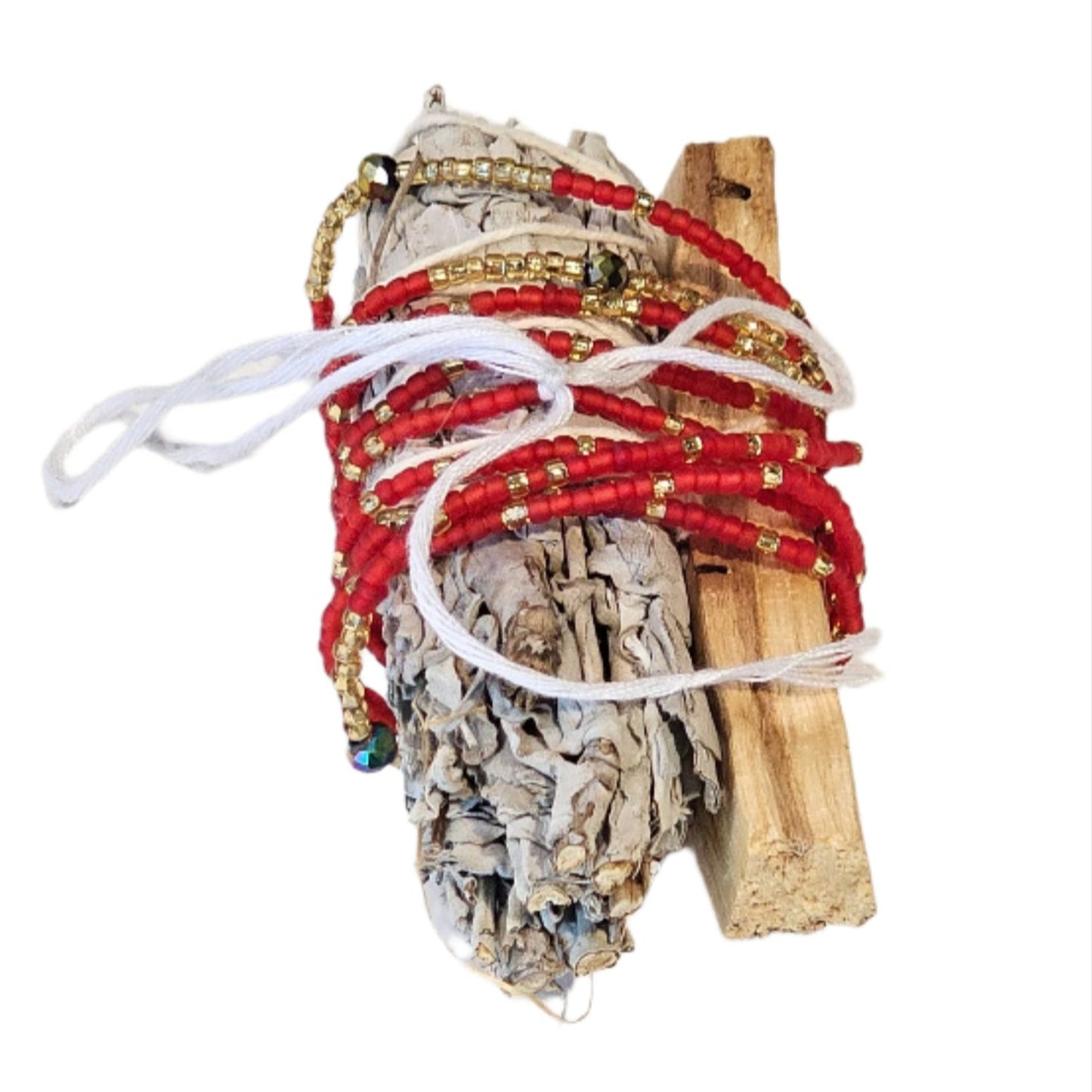 Decorative item with red ribbons and wooden elements on a white background